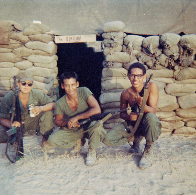 Rafael Perez and 2 other soldiers outside bunker